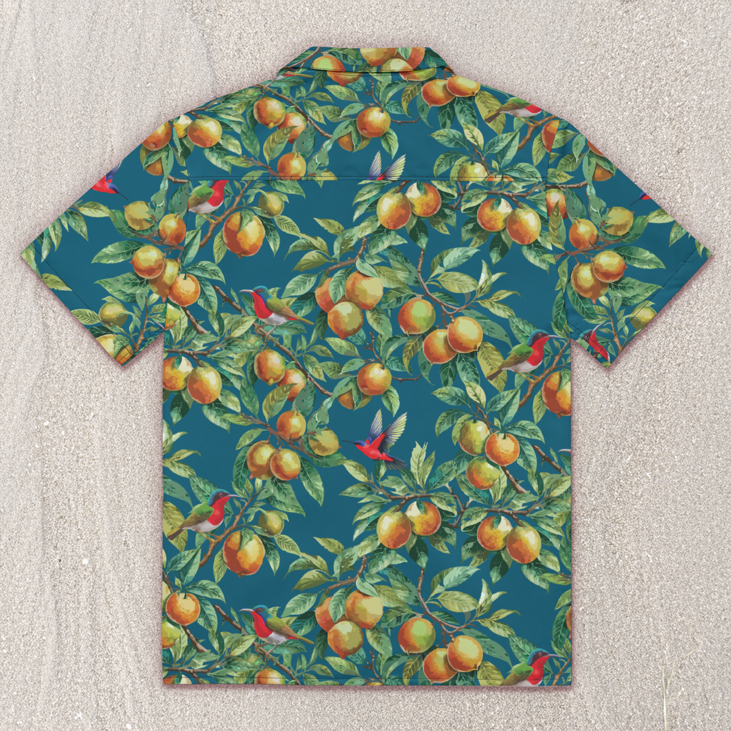 back of teal, yellow citrus print hawaiian shirt with red birds in boughs of citrus tree